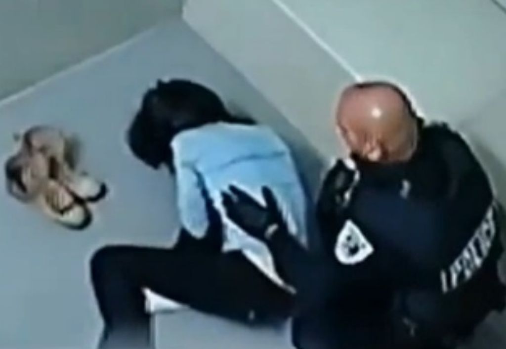 FOTO in VIDEO: Policist ji je skoraj zdrobil obraz