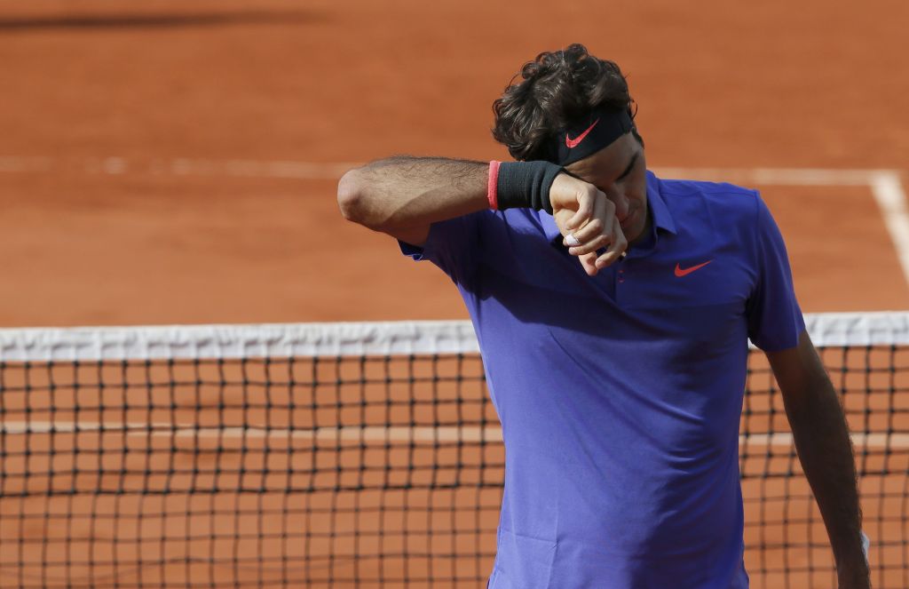 FOTO: Wawrinka nadigral Federerja, nosilec poškodoval gledalce